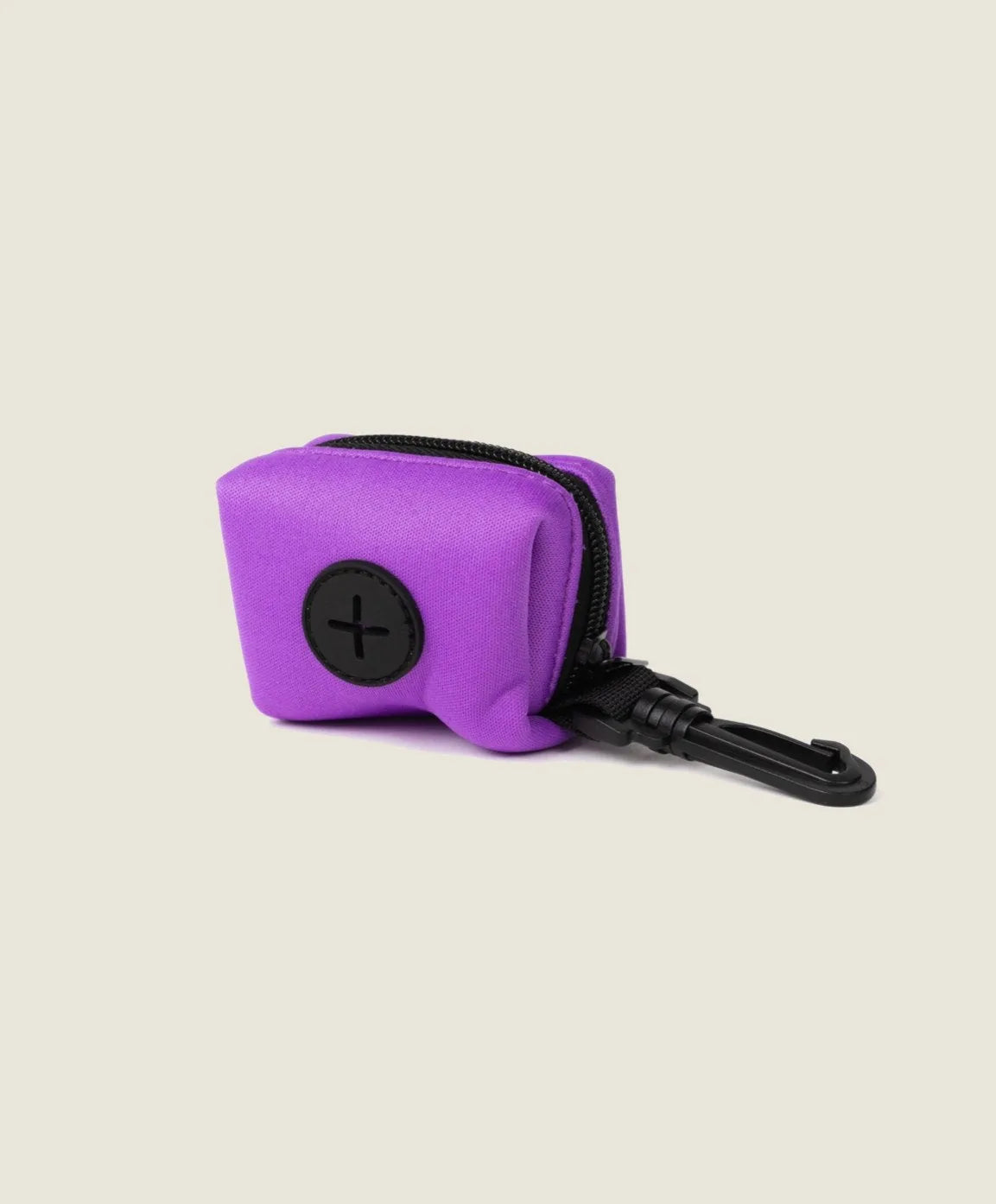 Electric fuchsia neoprene poop bag holder with a black clip and zipper, designed for dog walking convenience.