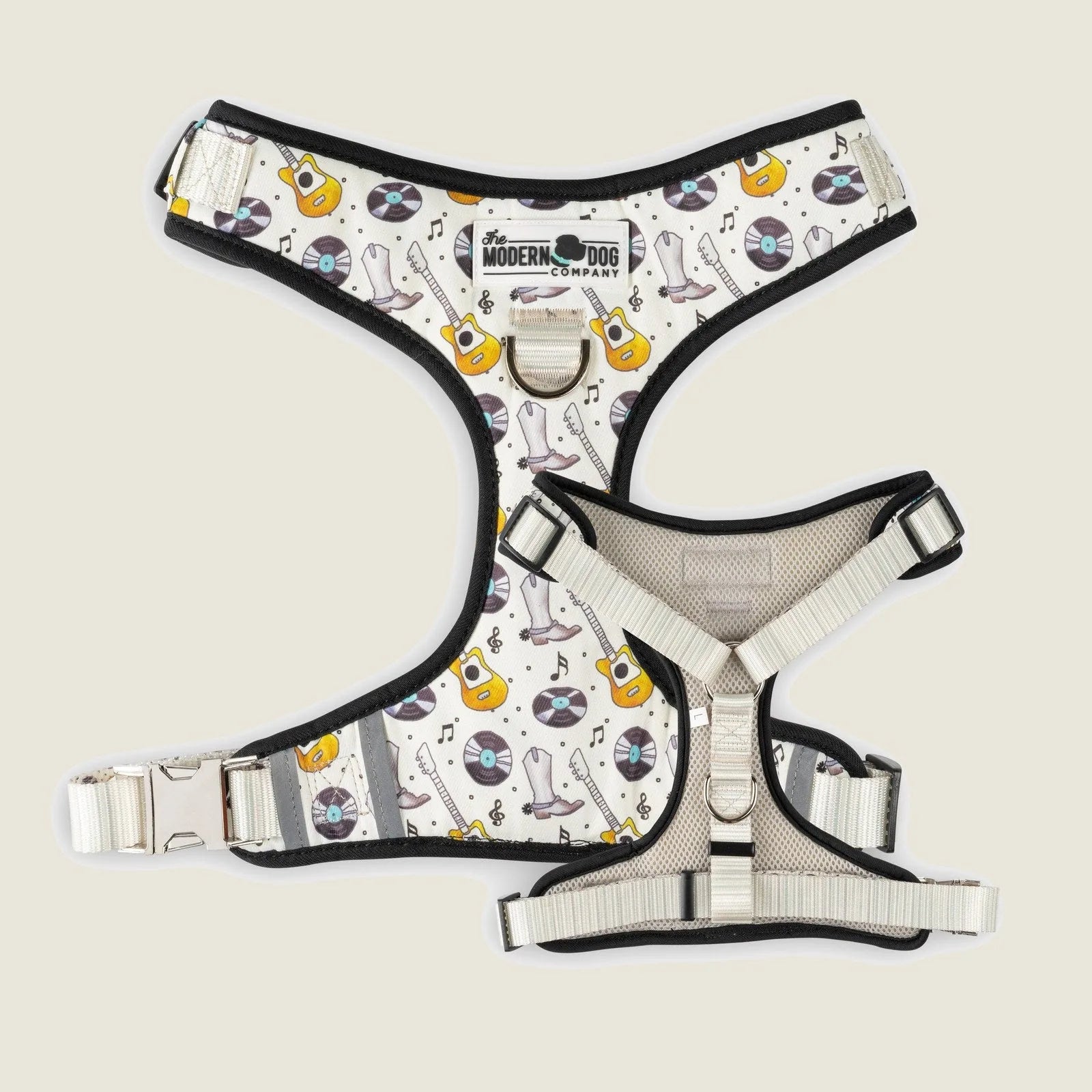 Nashville-themed dog harness with vinyl records and guitars, featuring adjustable straps and a double D-ring design.