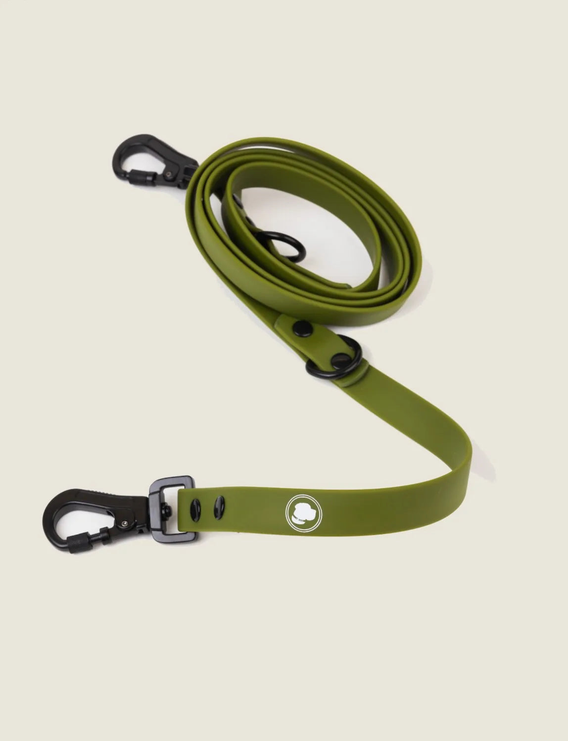 Olive green adjustable dog leash with a durable locking carabiner and a logo, laid out on a light background.