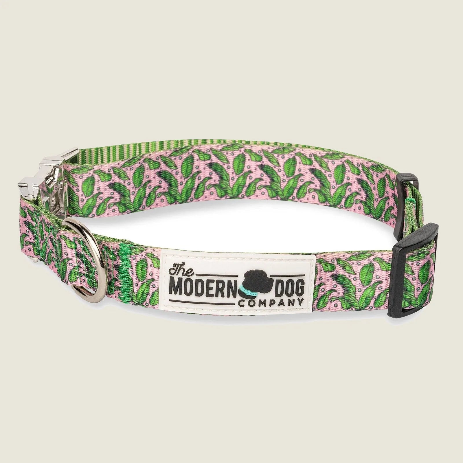 Adjustable pink and green tropical-patterned dog collar with durable metal buckle and D-ring from The Modern Dog Company.