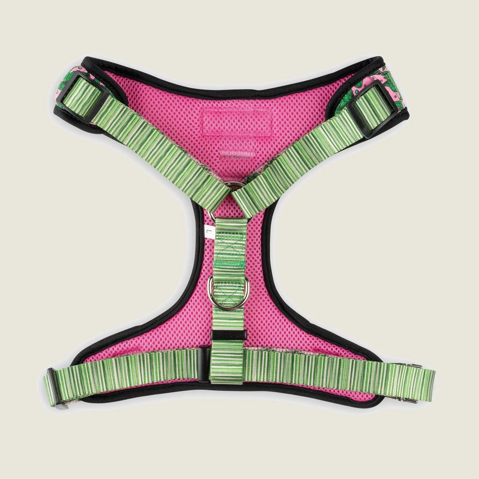 Pink Tropics dog harness featuring adjustable green straps and breathable mesh, ideal for outdoor adventures.