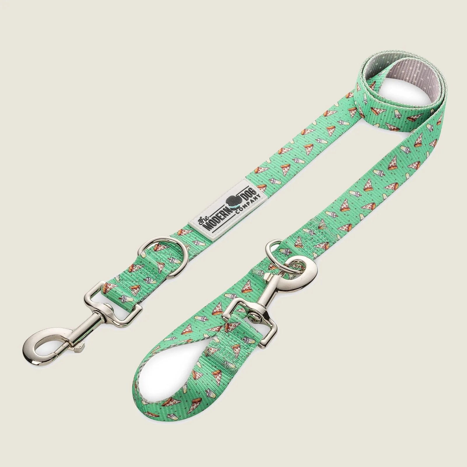 Bright green dog leash featuring a playful pizza slice pattern, adjustable with dual swivel bolt snap and D-ring.