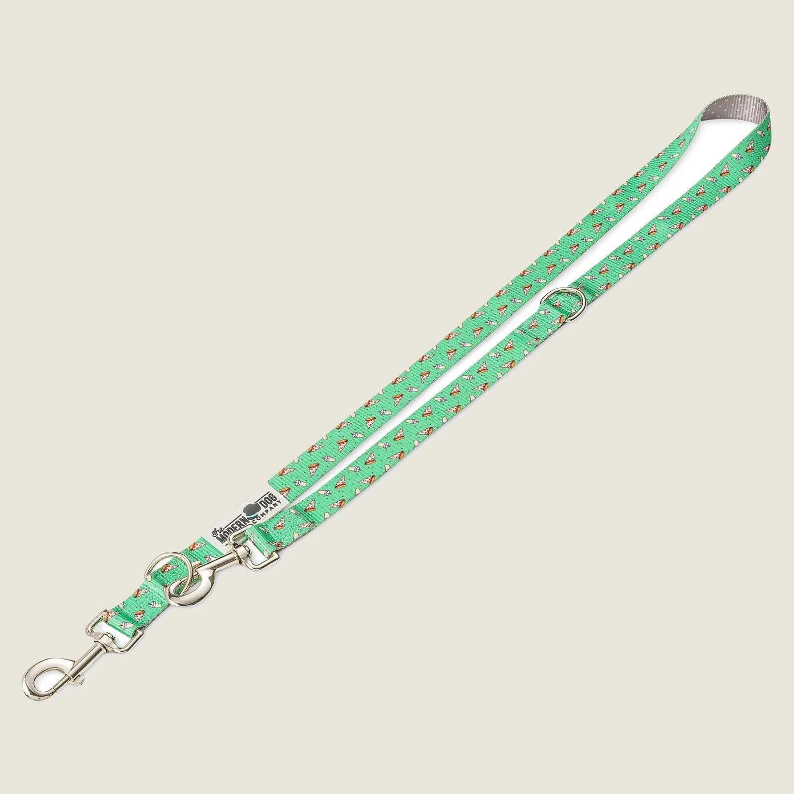Green dog leash featuring a playful pizza pattern, with adjustable length and dual swivel bolt snap.