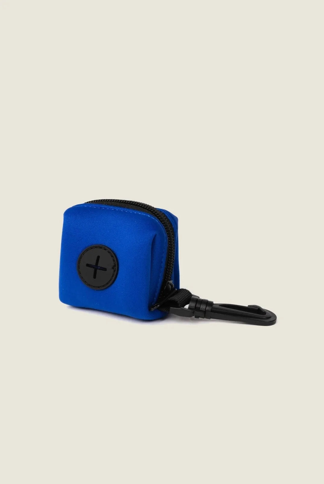 Royal blue neoprene poop bag holder with a black zip and clip, designed for easy attachment to leashes.