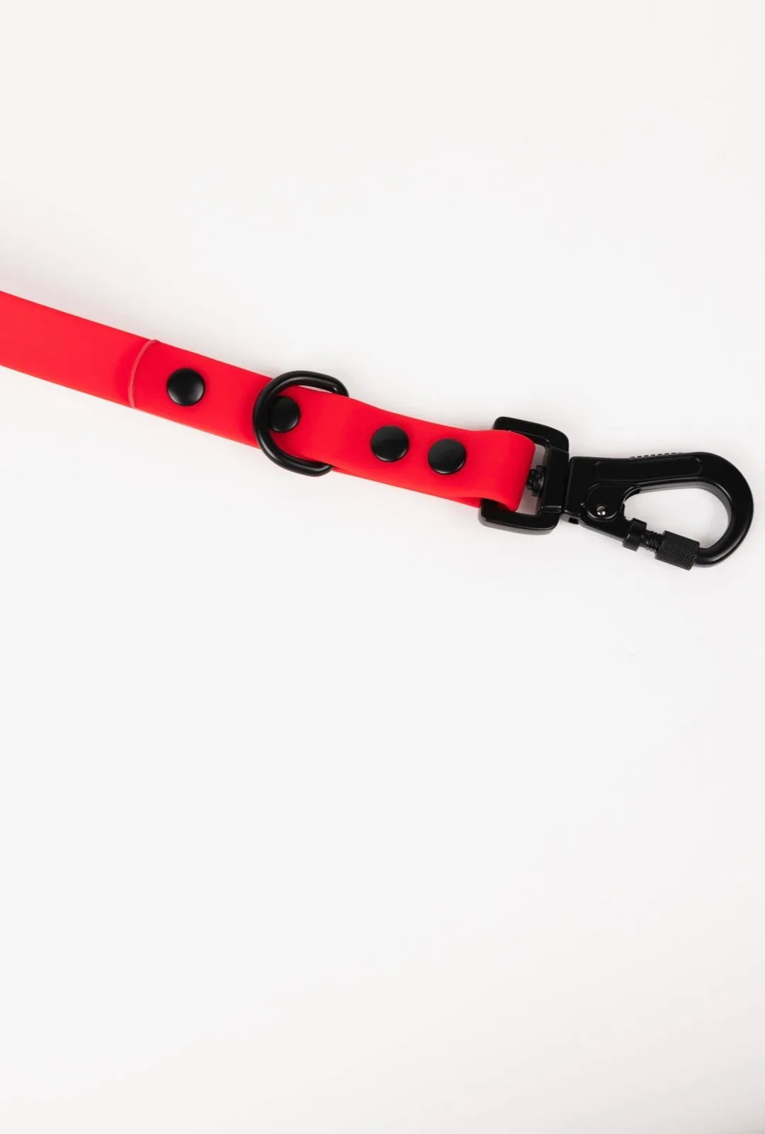 Ruby red adjustable dog leash featuring black hardware and buttons, designed for all-weather durability and easy cleaning.