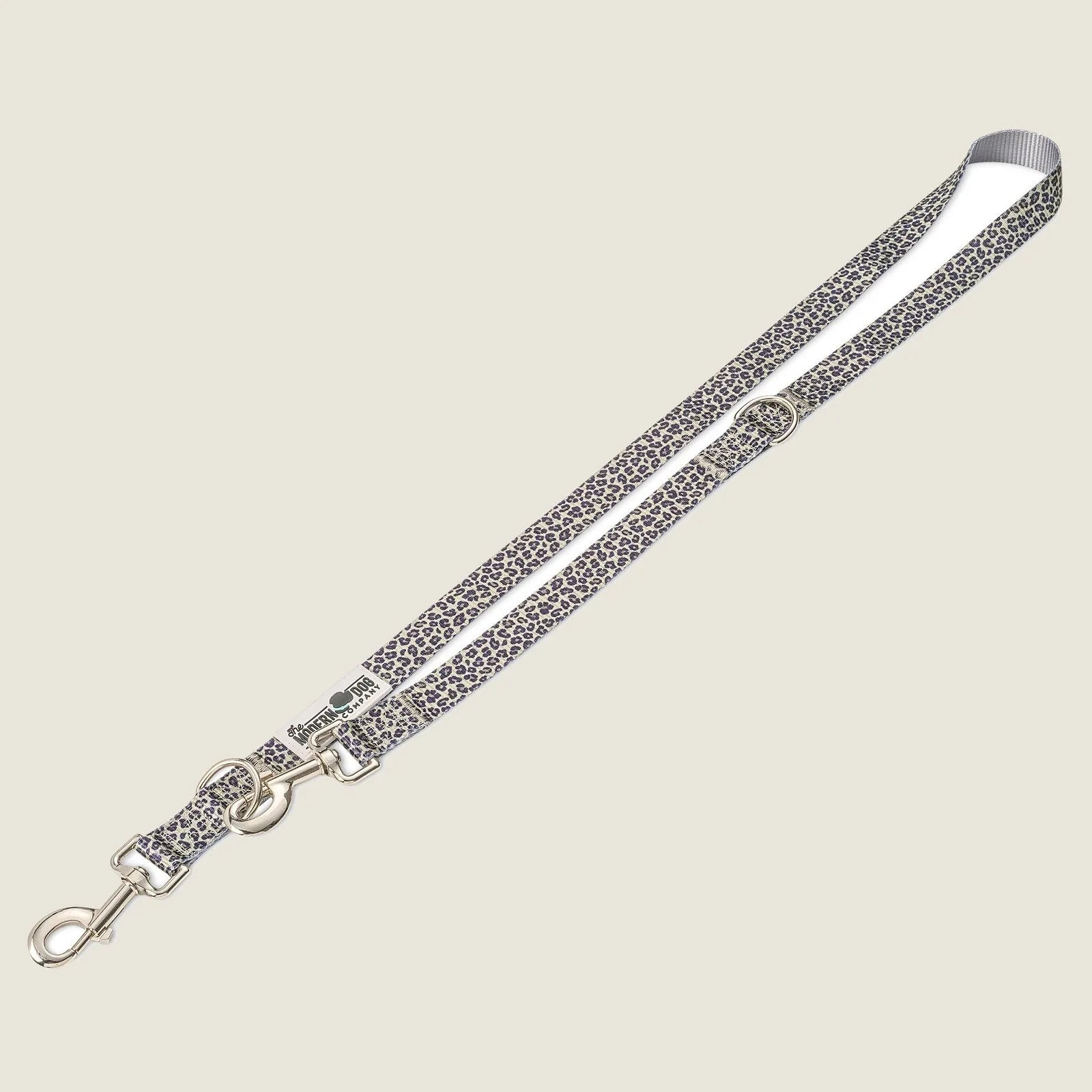 Leash featuring a dual swivel bolt snap and a playful leopard print, suitable for stylish dog walks and adventures.