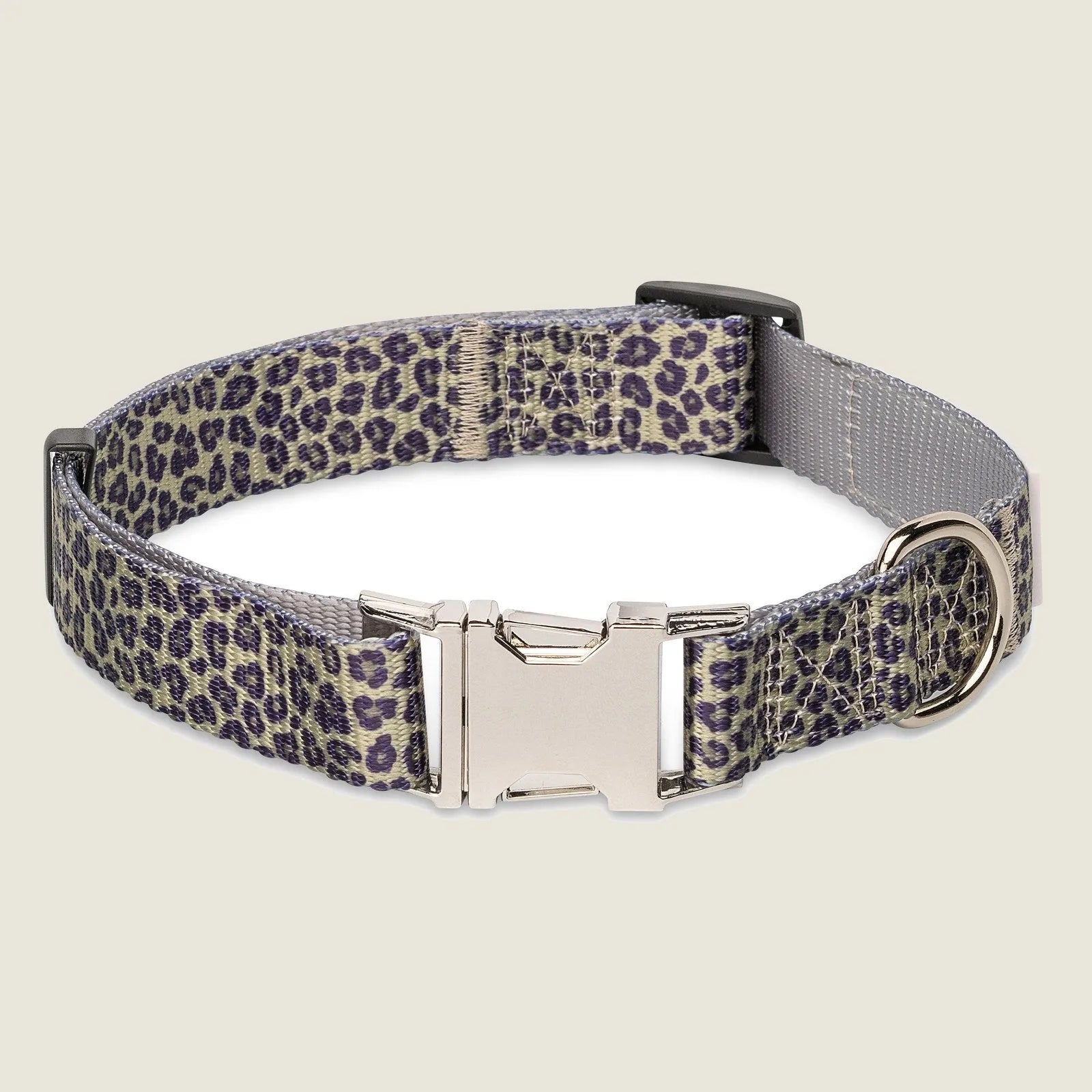 Adjustable leopard print dog collar with a durable strap and metal buckle for easy leash attachment.