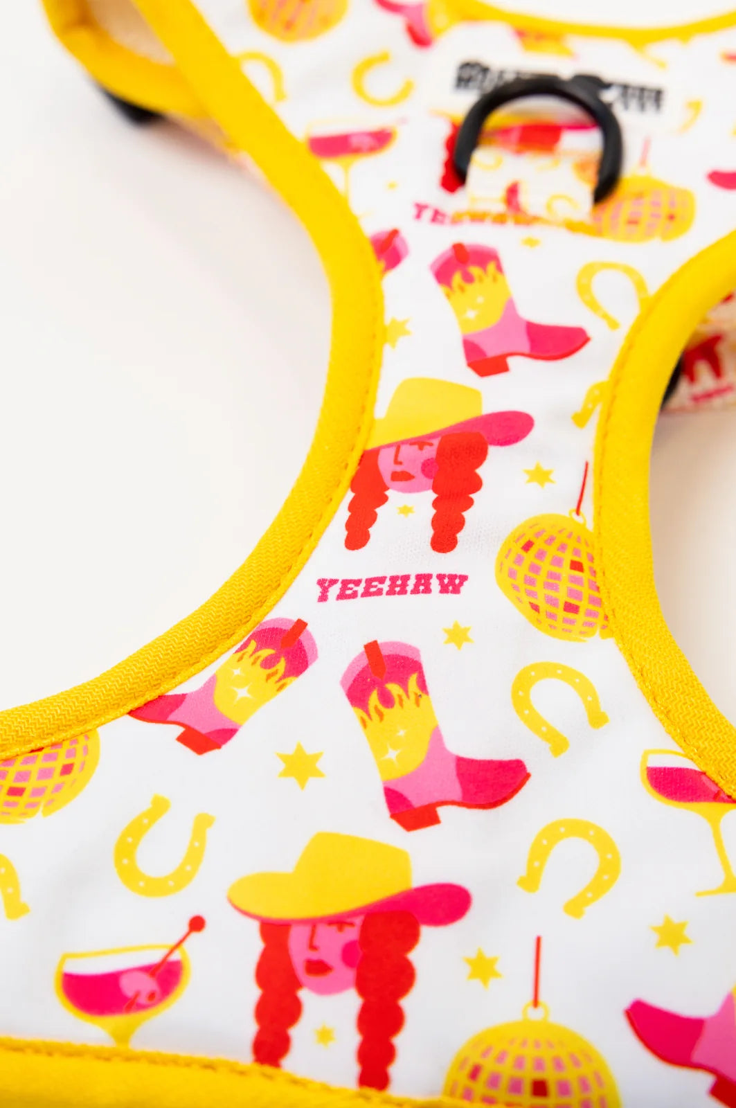 Colorful Yeehaw harness featuring stylish cowboy motifs in pink and yellow, with adjustable straps for a perfect fit.