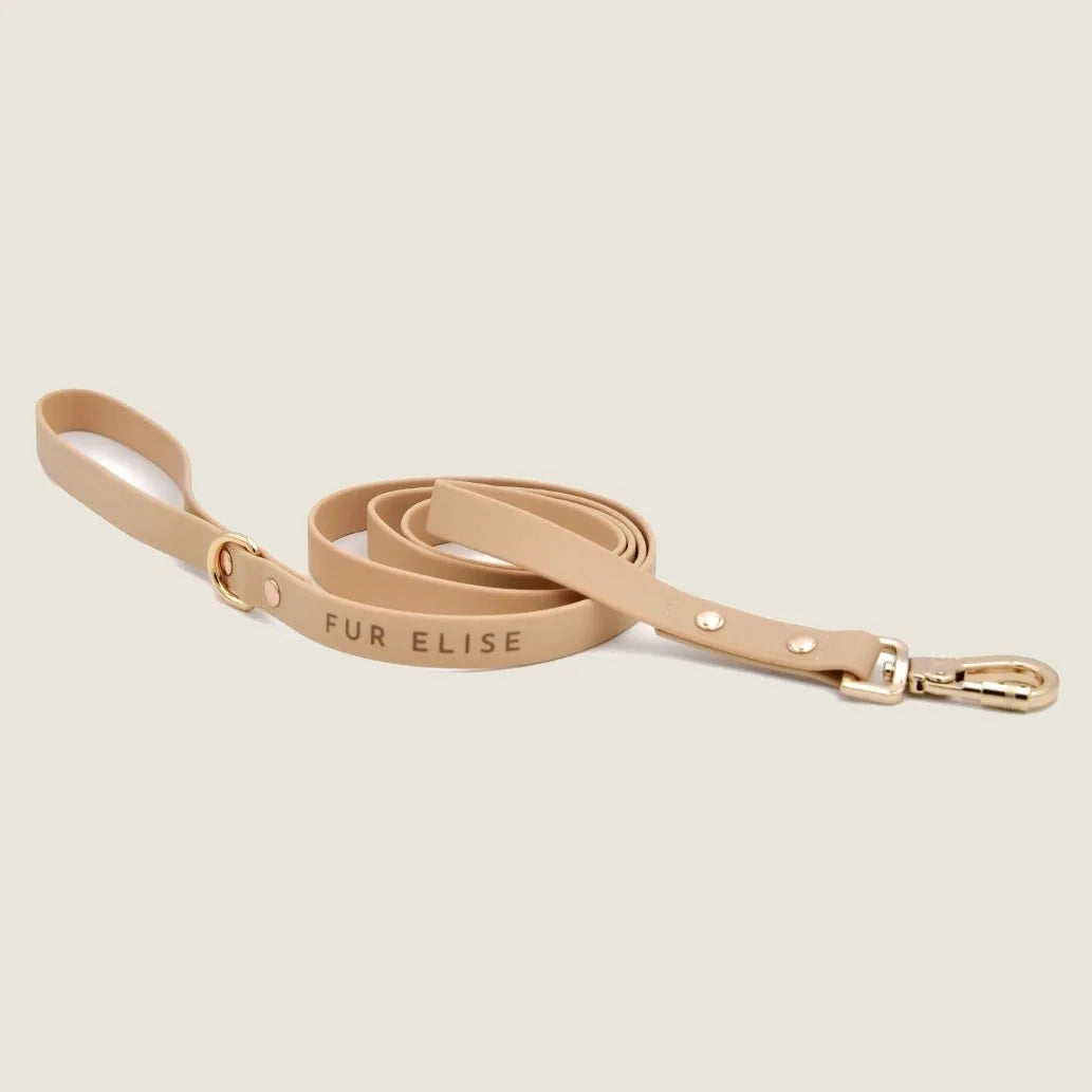 Beige dog leash with "FUR ELISE" inscription and a gold carabiner clip, designed for comfort and style.