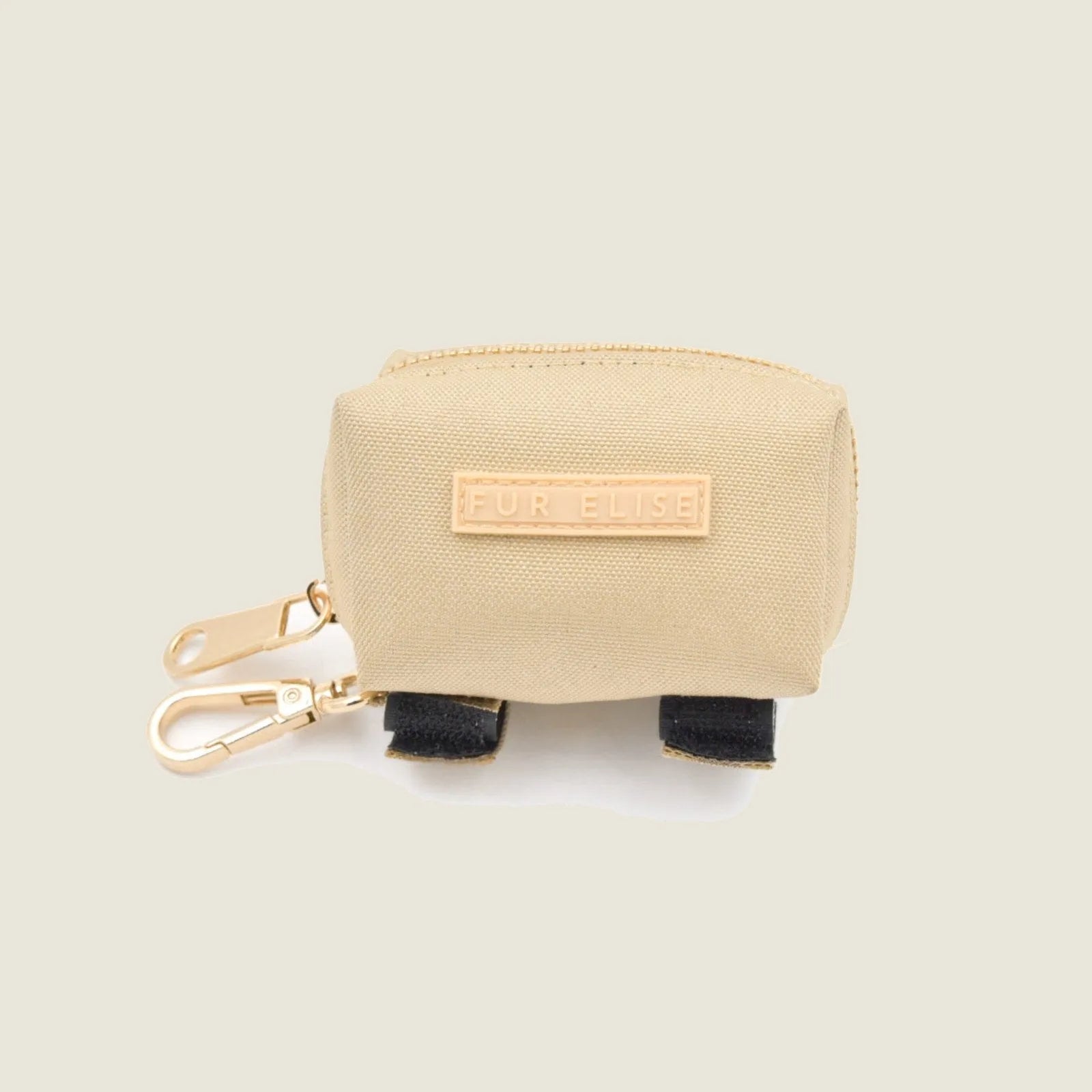 Dirt- and water-resistant beige poo pouch with gold clasp, labeled "FUR ELISE," featuring Velcro ties.