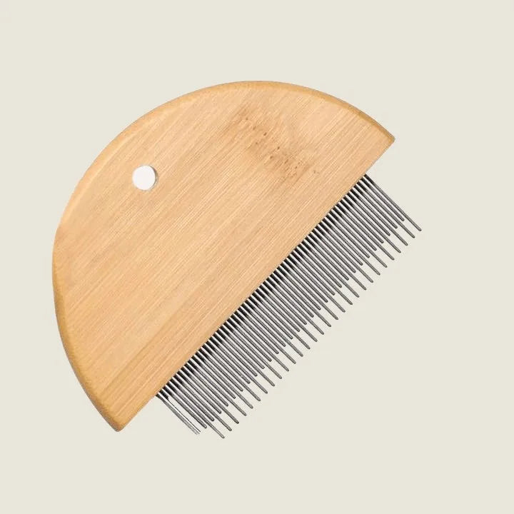 Bamboo flea detangler comb with rounded wooden handle and metal teeth for gentle grooming of dogs and cats.