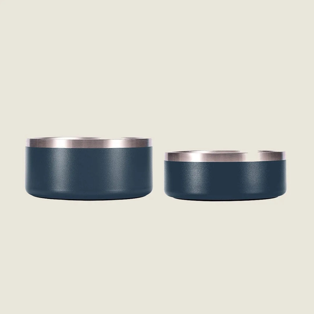 Stainless steel pet bowls in dark blue with silver rims, available in two sizes for dogs, set against a light background.
