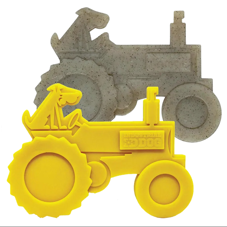 Durable yellow tractor-shaped nylon dog toy with a textured surface, designed for aggressive chewers.