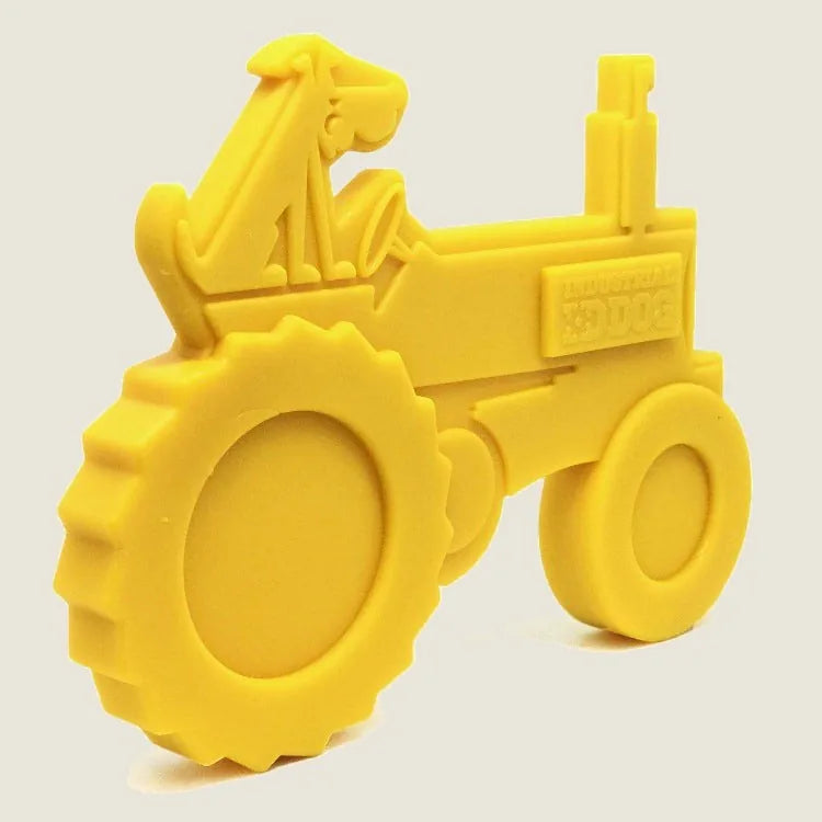 Bright yellow tractor-shaped nylon dog toy for heavy chewers, featuring a textured surface for dental health.