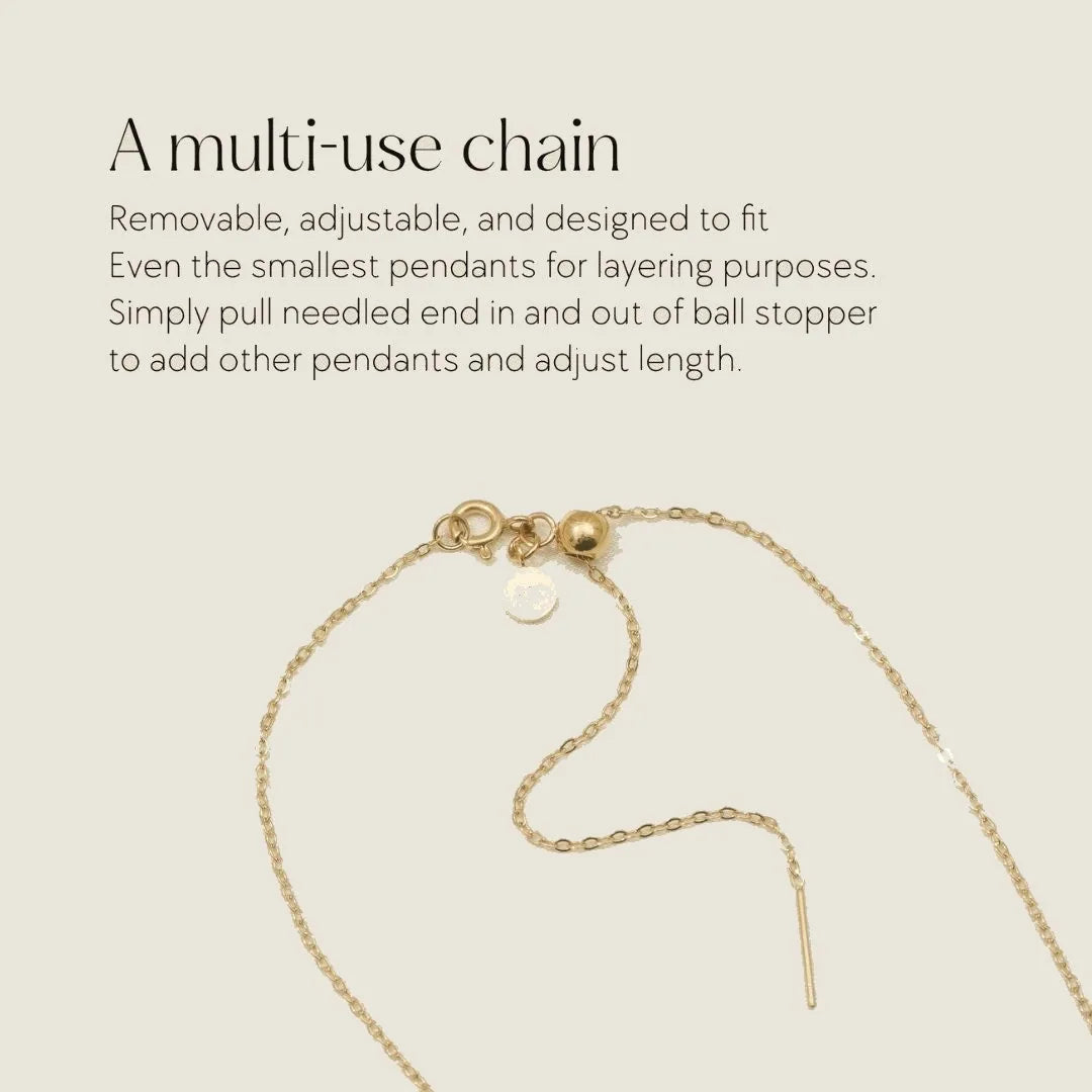 Adjustable gold chain with ball stopper, designed for layering and holding multiple pendants.