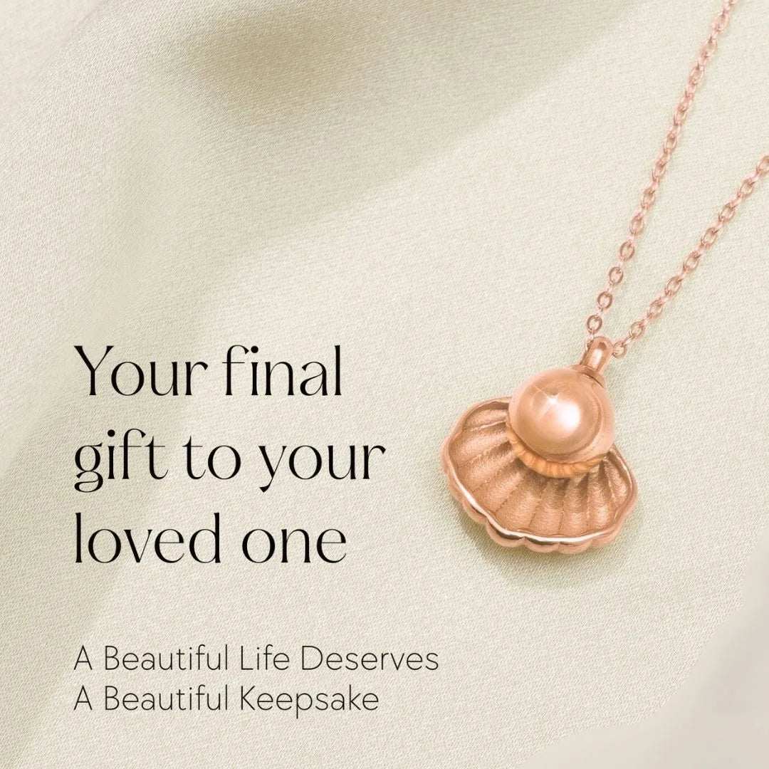 Rose gold memorial necklace in a seashell design, with a smooth surface and delicate chain, symbolizing cherished memories.