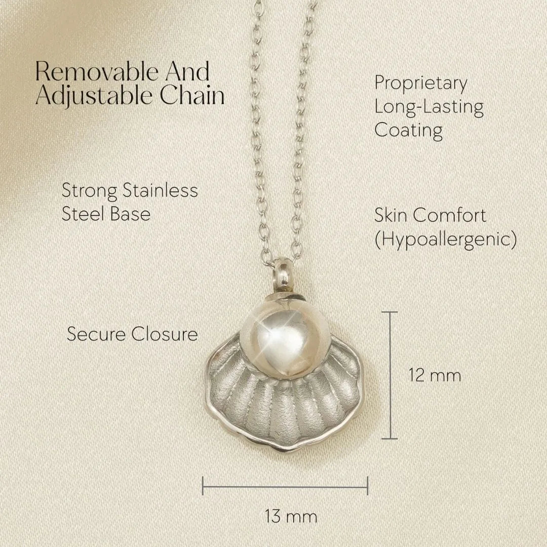Silver shell-shaped necklace with a pearl, featuring an adjustable chain and secure closure for memorial keepsakes.