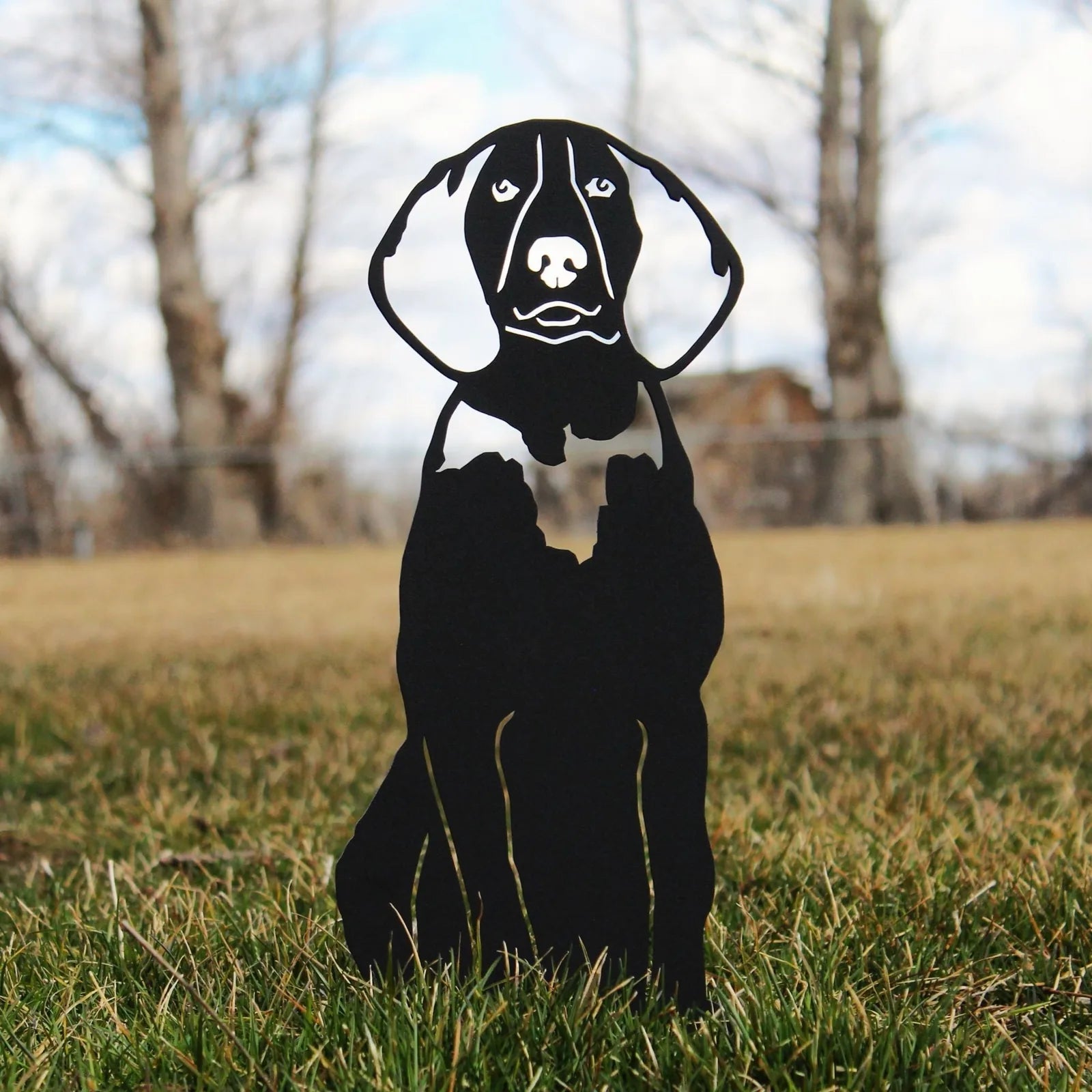 Sleek black metal silhouette of a Treeing Walker Coonhound on grass, perfect for outdoor dog decor.