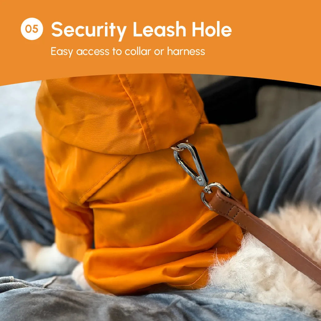 Tribeca adjustable velcro raincoat in bright egg yolk color with leash hole for easy collar access.