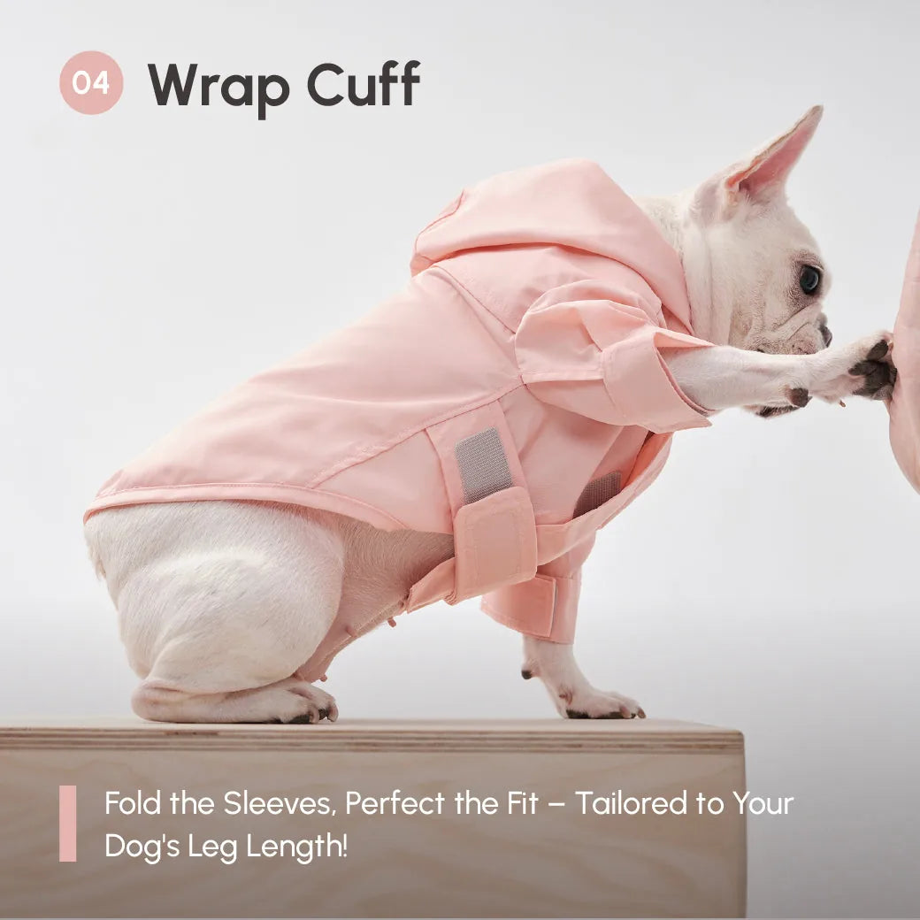 Light pink adjustable raincoat with velcro closure on a small dog, demonstrating the wrap cuff design for a perfect fit.