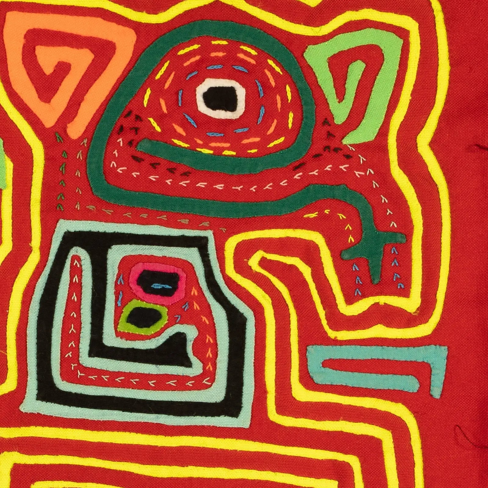 Colorful abstract design featuring vibrant red, green, and yellow patterns, showcasing intricate hand-stitched textile art.