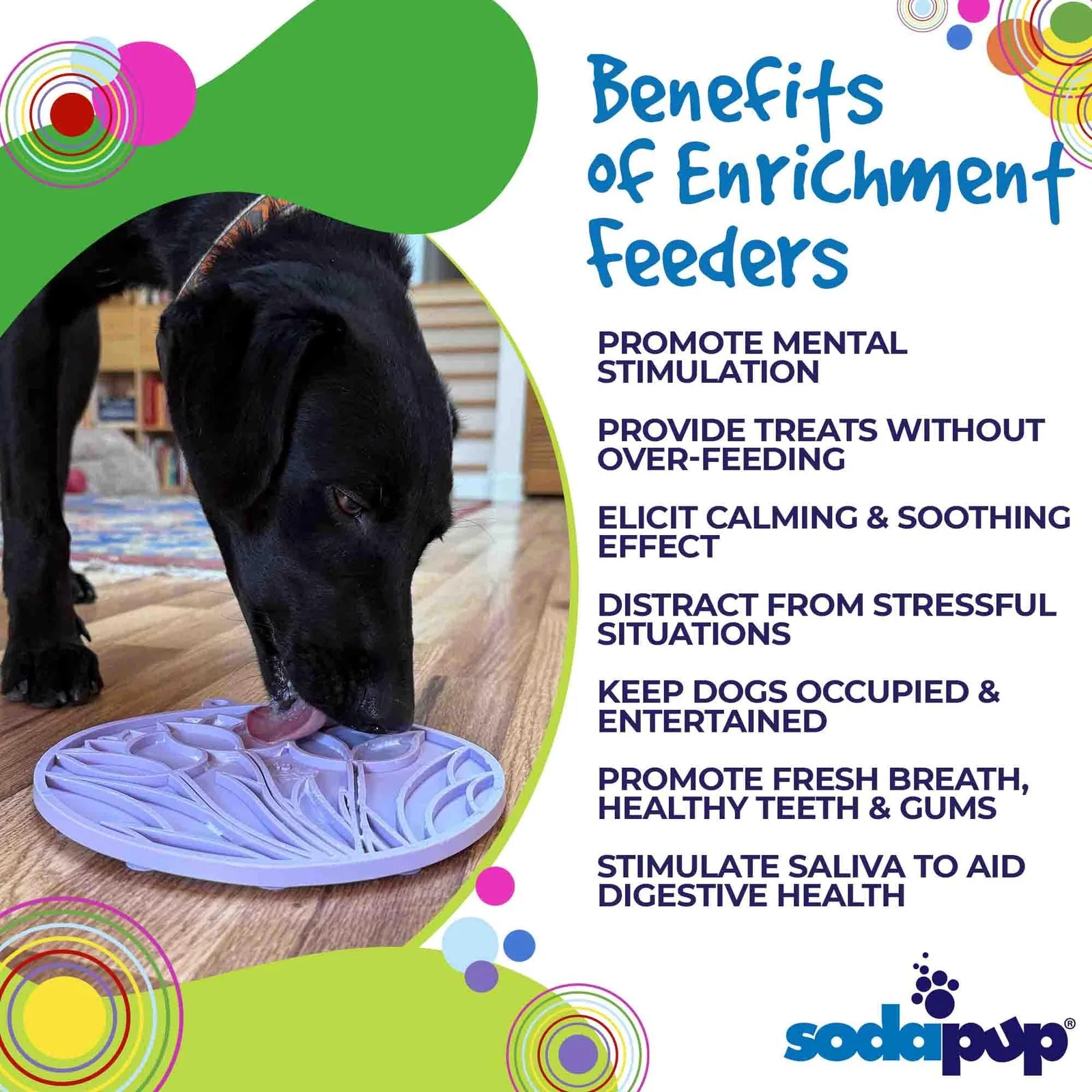 Black dog licking a pastel purple tulip design eMat on a wooden floor, promoting mental enrichment and calming activities.