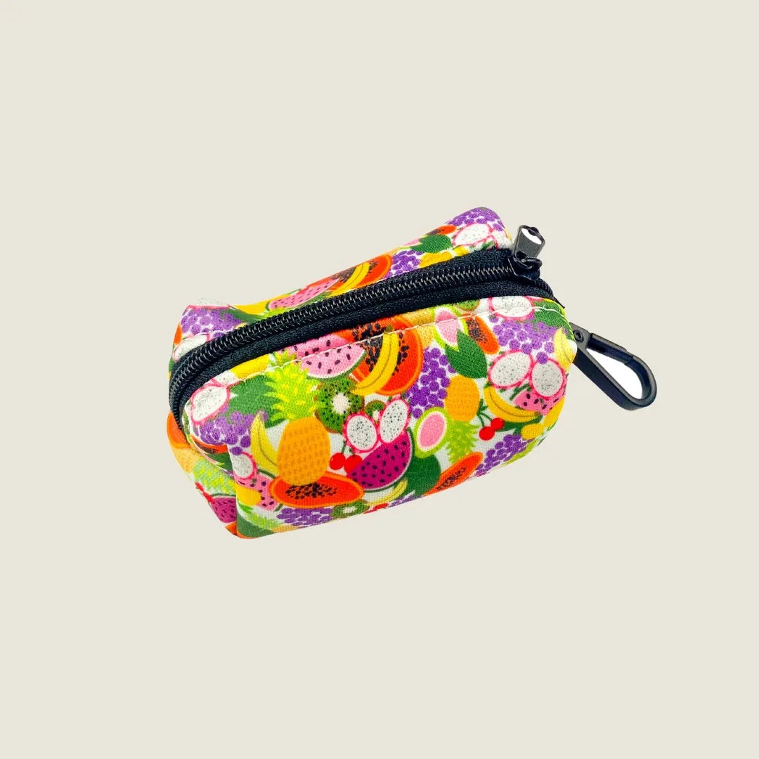 Colorful Tutti Frutti waste bag designed by EverWoof, featuring a vibrant fruit pattern and a zipper closure.
