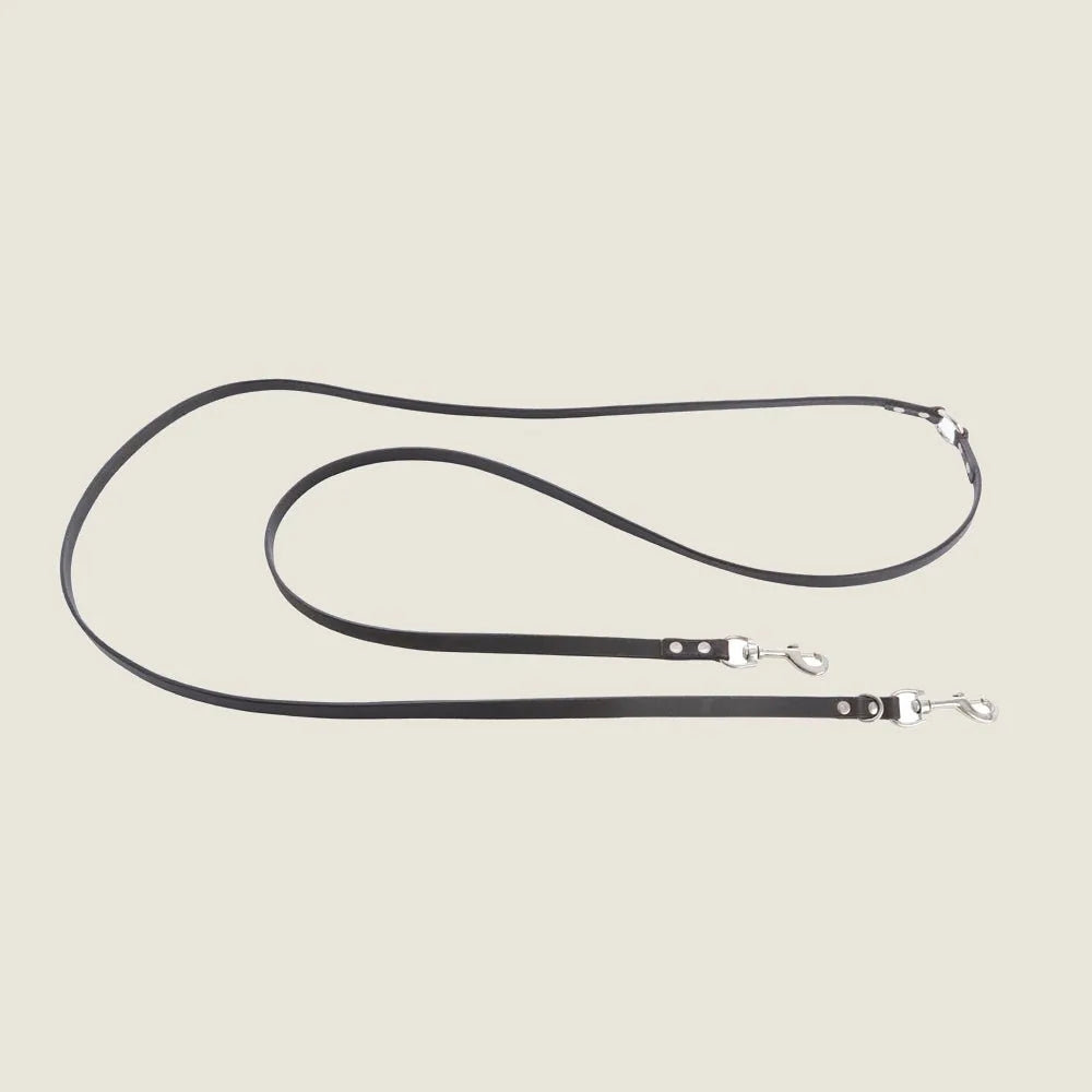Sleek ebony leather dog leash with iron hardware, measuring 103 inches, designed for stylish and durable everyday walks.