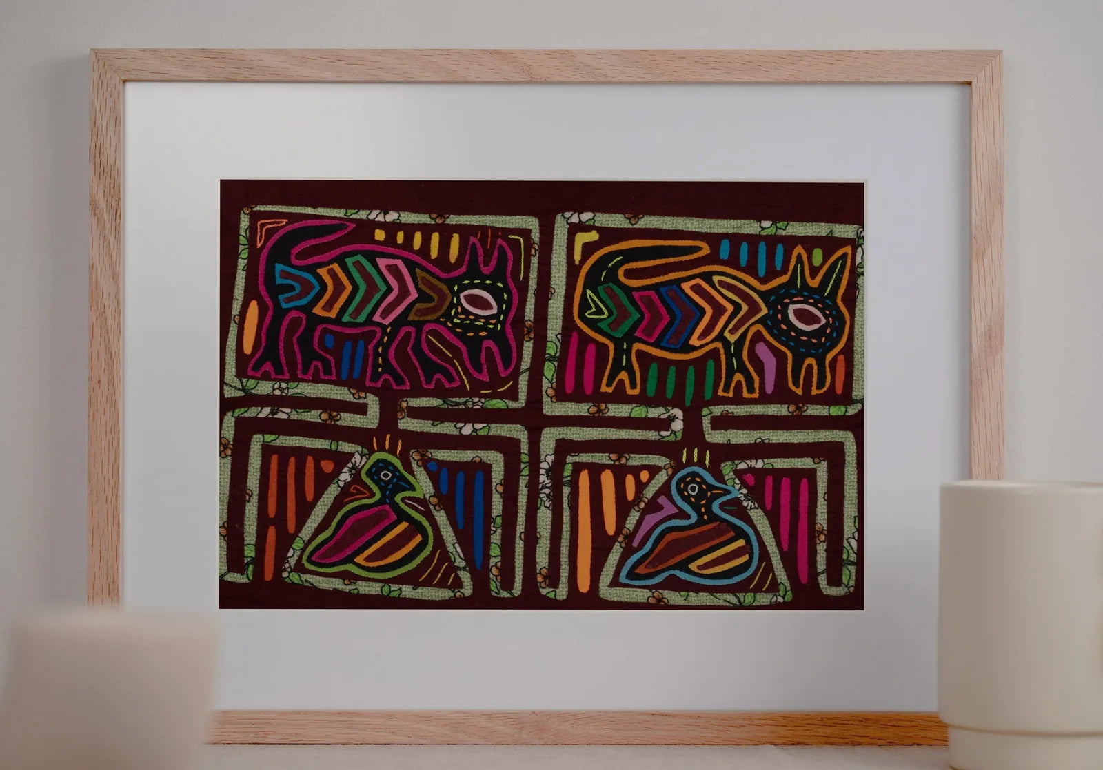 Hand-stitched Panama Mola featuring colorful vintage bird and puppy designs on a dark background.