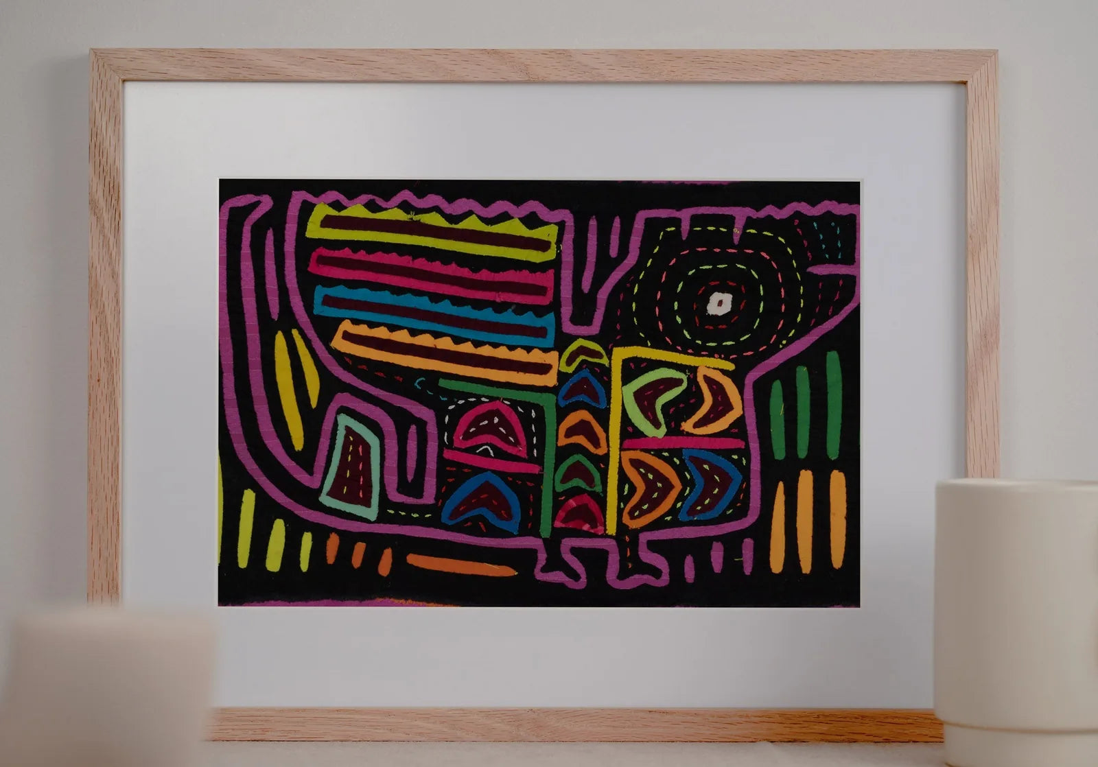 Colorful vintage black and purple Mola textile artwork featuring abstract dog design with geometric patterns.