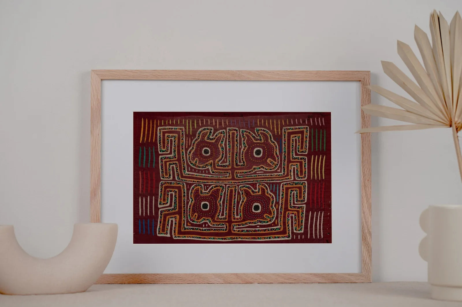 Hand-stitched vintage burgundy tapestry featuring a yapping puppy design, framed with intricate colored details.