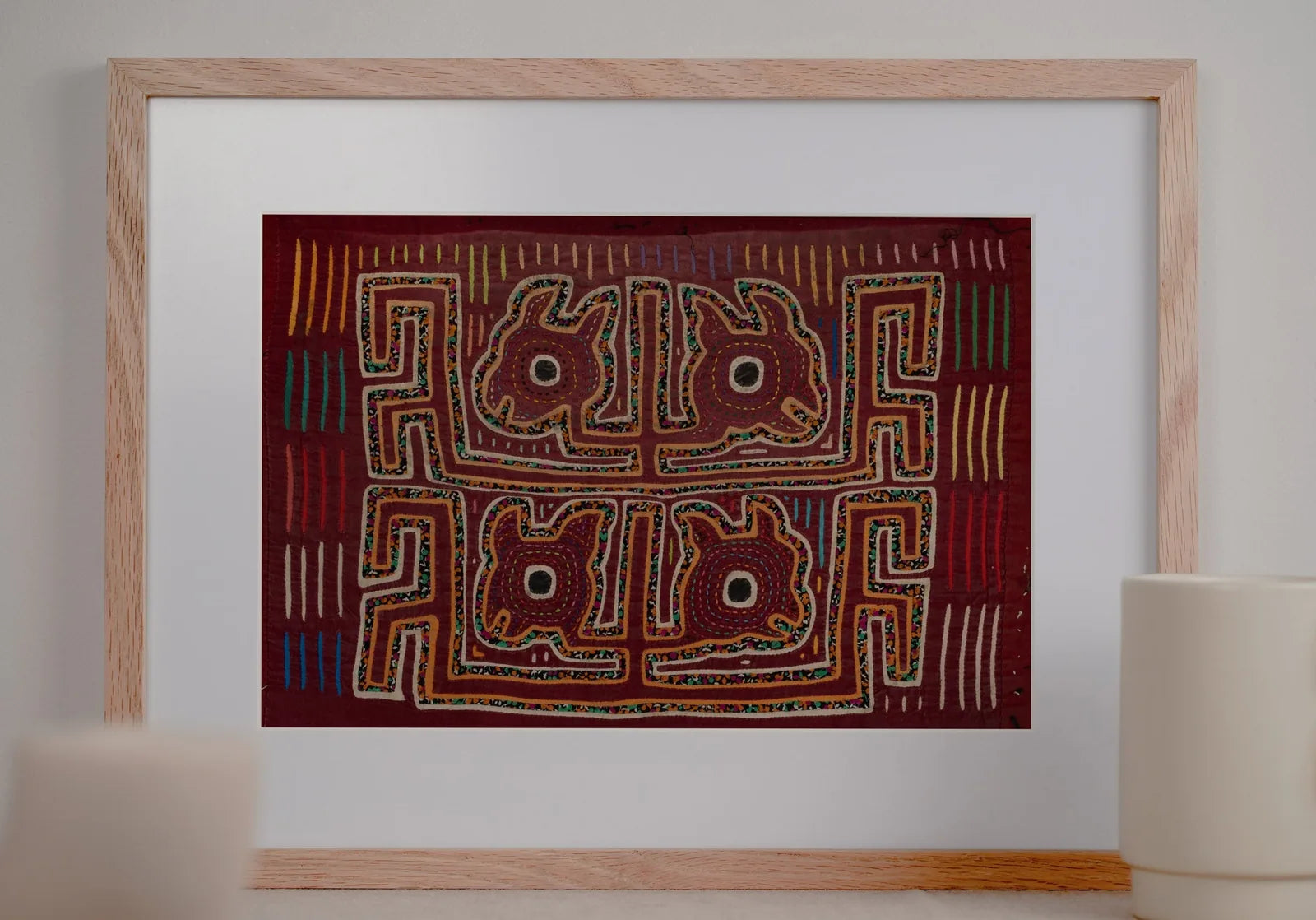 Vintage burgundy Mola featuring a yapping puppy design, hand-stitched with colorful, layered patterns on textile art.