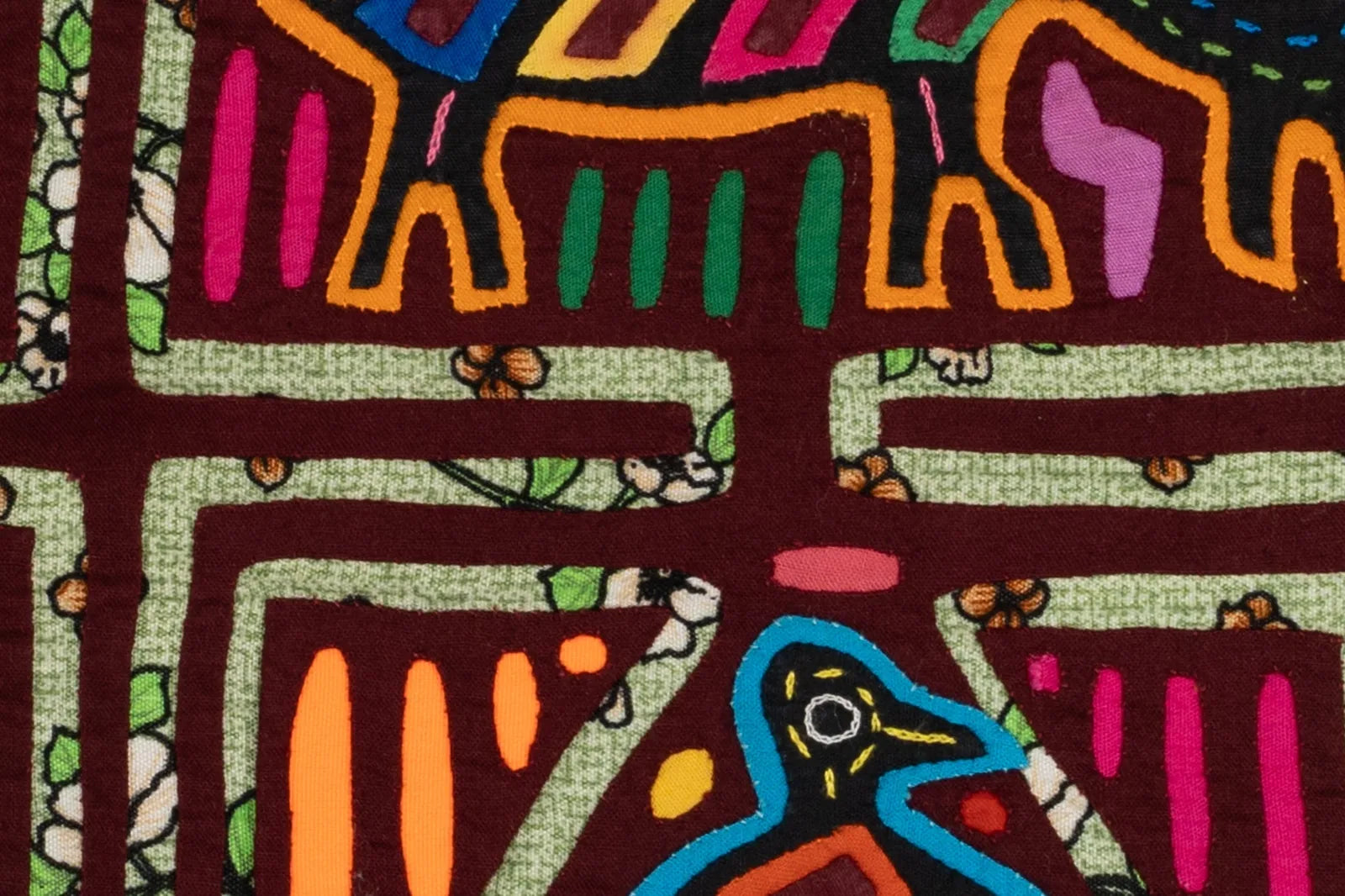 Hand-stitched tapestry featuring a colorful puppy and bird design on a unique green and burgundy patterned background.