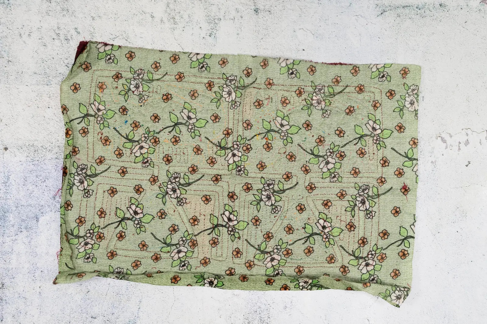 Vintage green tapestry with floral pattern, hand-stitched details, showcasing a puppy dog and bird design.
