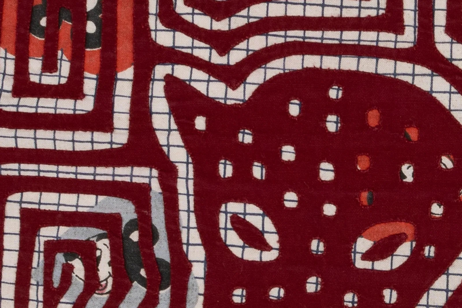 Hand-stitched vintage tapestry showcasing a playful puppy design in vibrant red and blue fabrics.