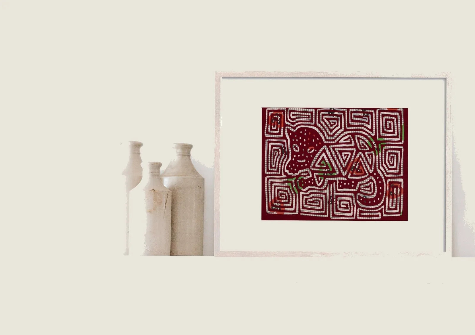Hand-stitched vintage puppy dog mola tapestry in red, featuring intricate patterns and vibrant colors, framed for display.