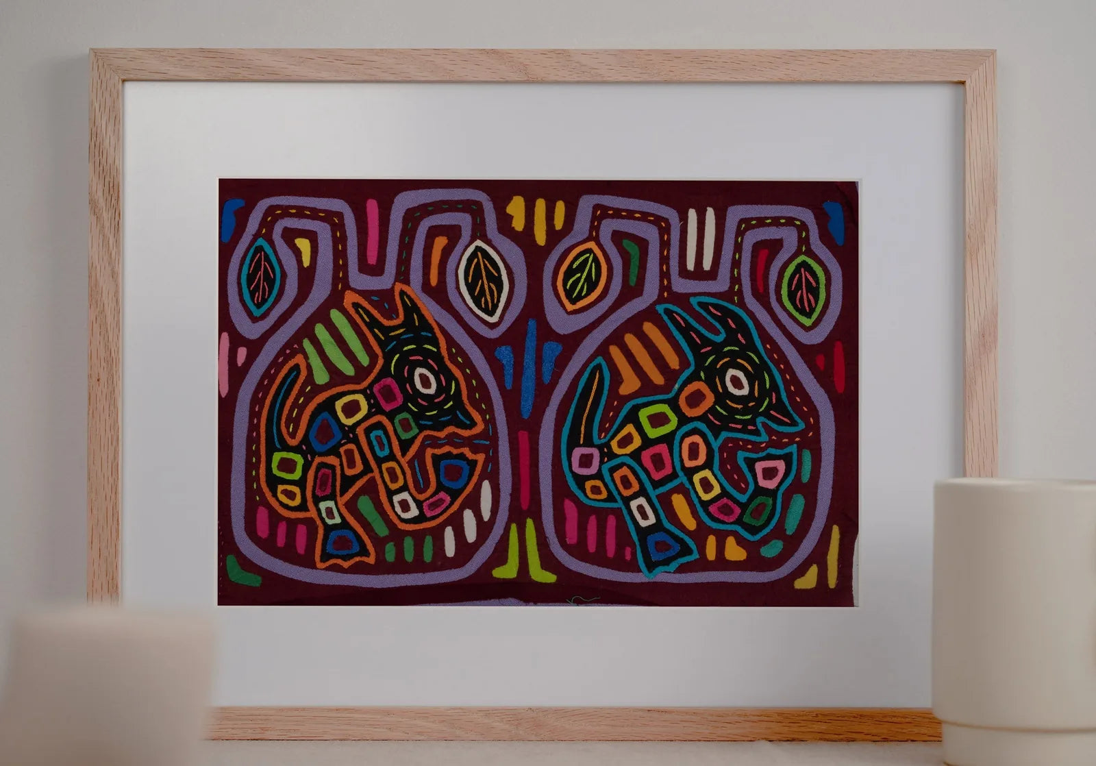 Colorful hand-stitched Mola tapestry featuring whimsical dog designs on a dark background. Perfect for wall decor.