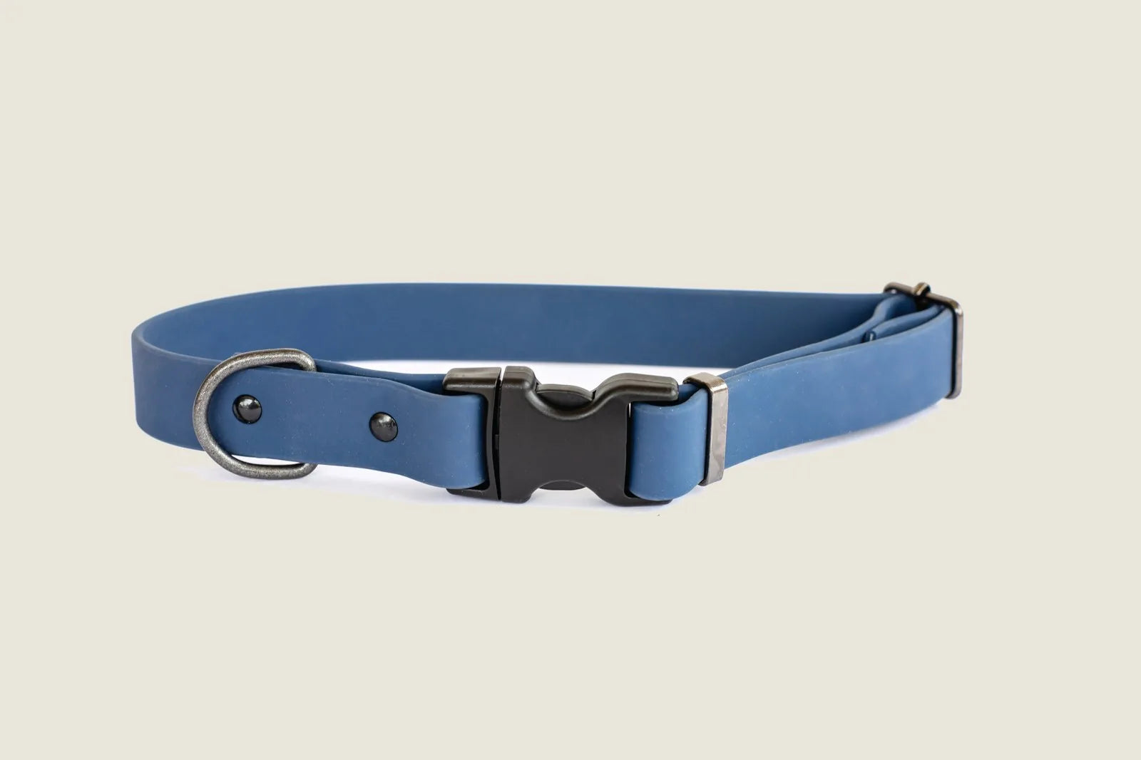 Waterproof blue dog collar made of soft PVC with adjustable sizing and YKK buckle for durability and comfort.
