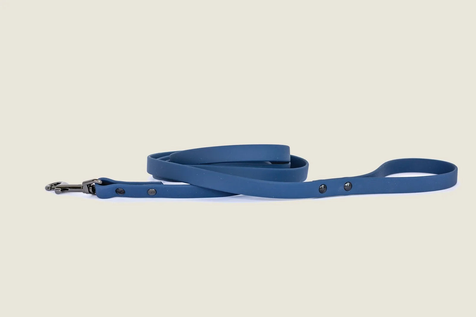 Waterproof blue PVC dog leash with a soft texture and durable hardware, designed for comfort and style during walks.