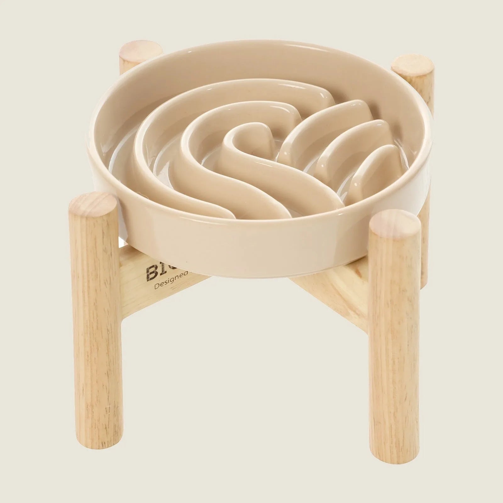 Beige slow feeder dog bowl with a wavy interior design on a wooden stand, promoting better eating posture.