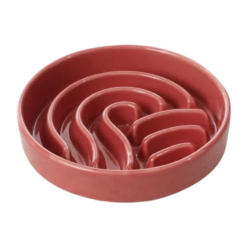 Ceramic slow feeder dog bowl in pink, featuring a wavy design to promote slower eating for better digestion.