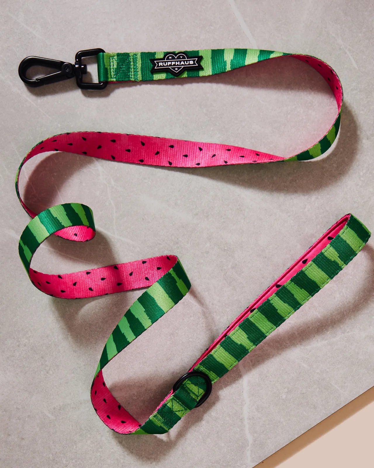 What-A-Melon dog leash featuring a pink and green watermelon design with a neoprene handle and swivel snap clasp.