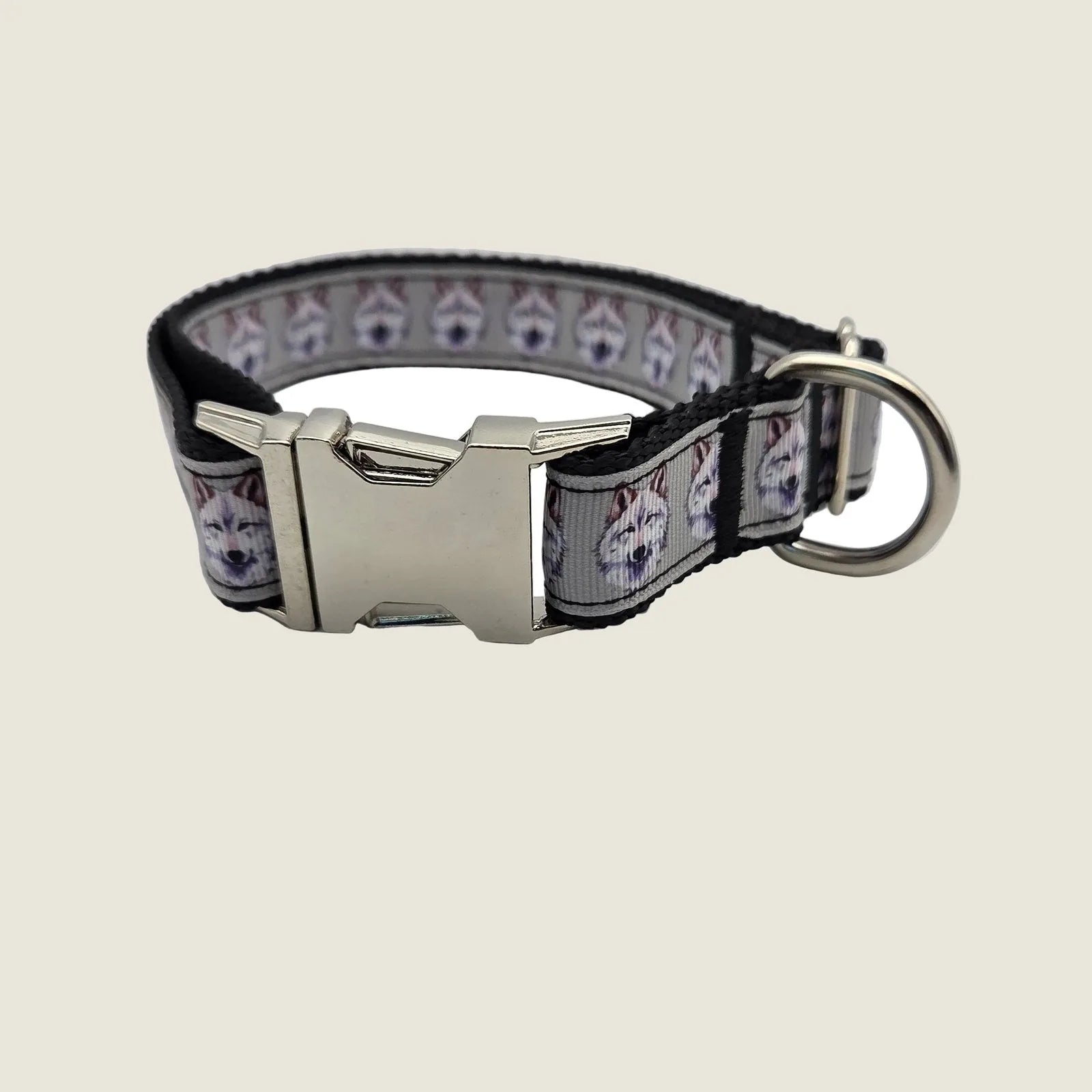 Gray nylon dog collar featuring detailed wolf faces, adjustable from 14.5" to 23.5", with a metal buckle and D-ring.