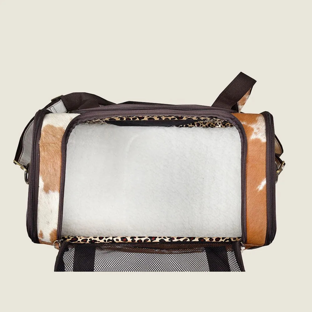 Light-colored Hairon leather dog bag with netted window and plush interior, ideal for traveling with small dogs.