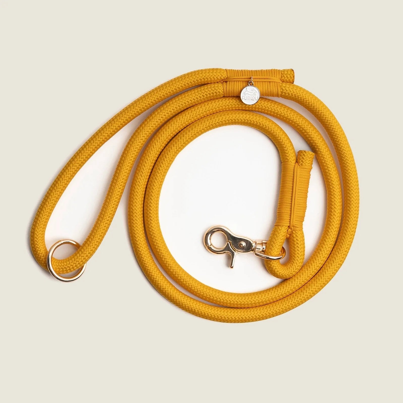 Durable yellow braided rope leash with reinforced stitching and an O-ring for accessories, perfect for daily dog walks.