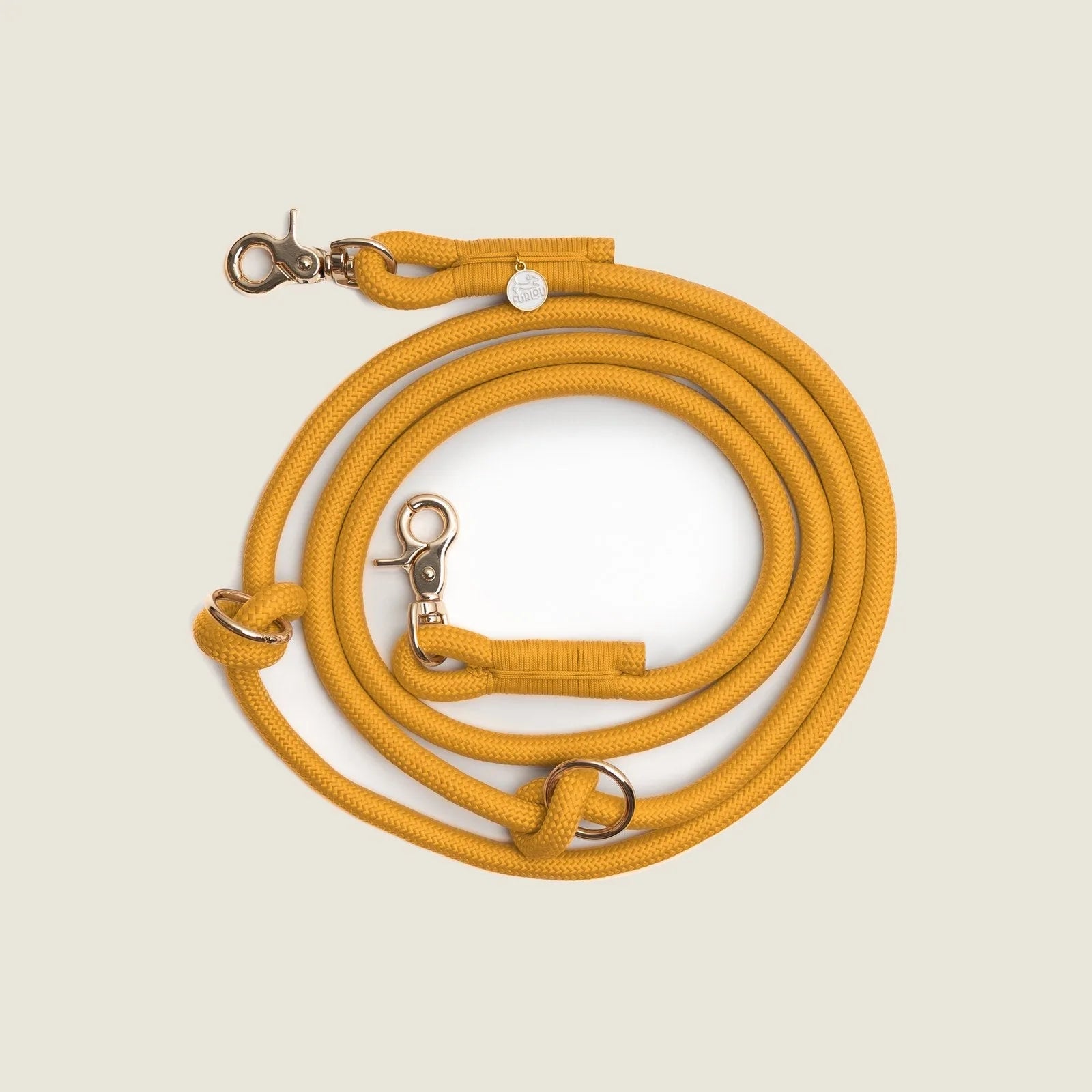 Hands-free braided leash in vibrant yellow, featuring gold-toned clips and sturdy fabric for durability.